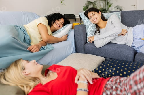 Preview: Three young girls relaxing after slumber party at home