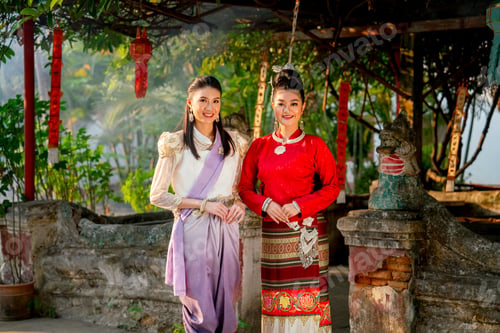 Preview: Close up portrait of two beautiful Asian woman stand in front of old or ancient architecture