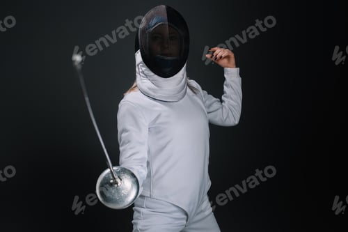 Preview: Selective focus of fencer holding rapier isolated on black