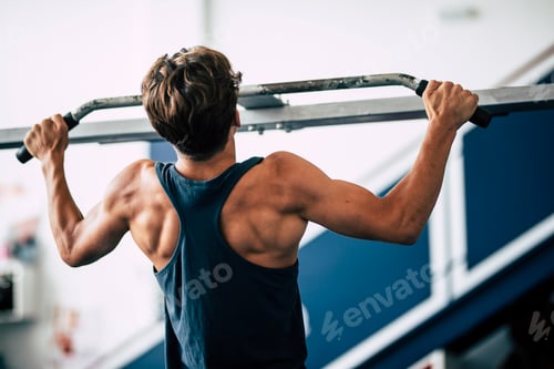 Preview: one teenager at the gym alone working is body and training doing elevations