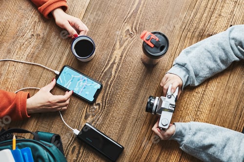 Preview: Family planning vacation trip. Searching routes using navigation map on mobile phone. Phone charging