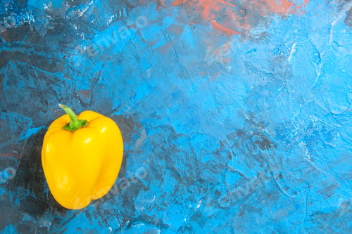 Preview: top view yellow bell-pepper on blue background color photo food salad vegetables