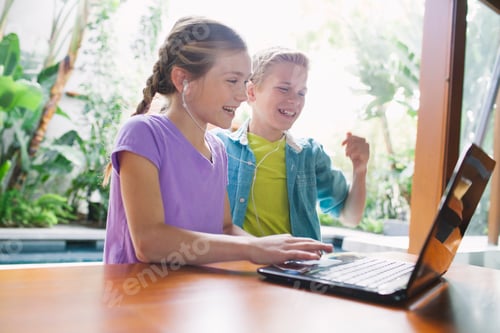 Preview: Girl and boy using laptop