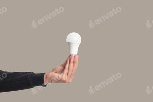 Preview: light bulb on hand with white background. Energy bright and smart creativity thinking concept