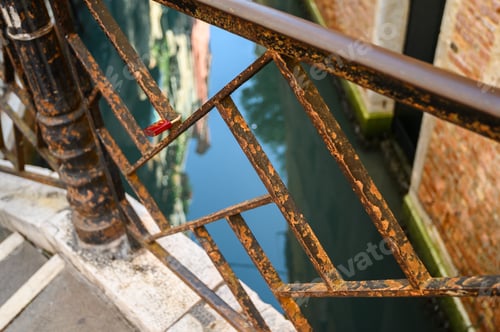 Preview: rusty railing on an old bridge. Venice, Italy