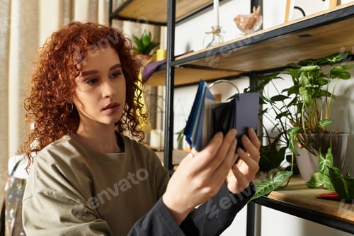 Preview: Creative young woman exploring modern DIY craft projects in a stylish indoor space