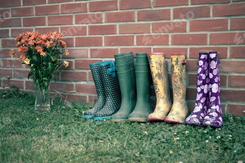 Preview: Wellington boots by brick wall