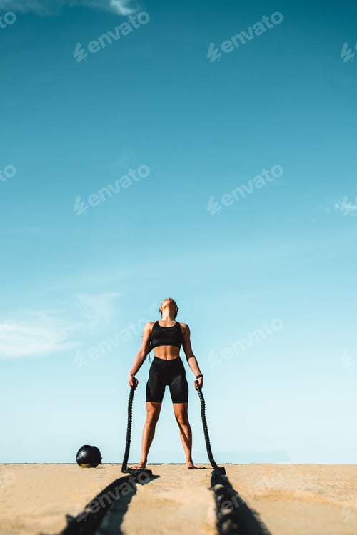 Preview: Sportive girl training on the beach