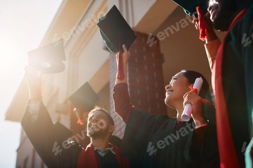 Preview: Below view of cheerful students celebrating on their graduation day.