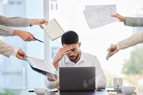 Preview: This is too much for me. Shot of a young businessman looking stressed at work.