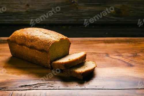 Preview: Homemade sponge cake on wooden table. Sliced soft pound cake.