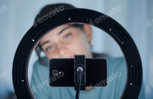 Preview: Young woman live streaming a video