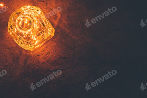 Preview: Lights garland in a glass bottle on a dark background