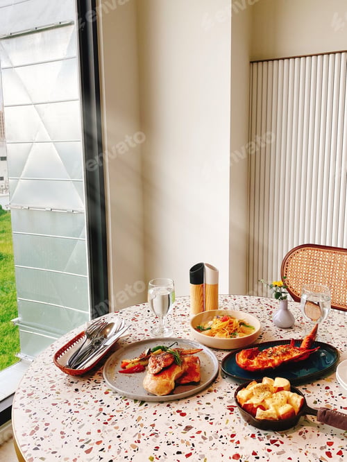 Preview: Freshly prepared meal laid out on a table in front of a glass door
