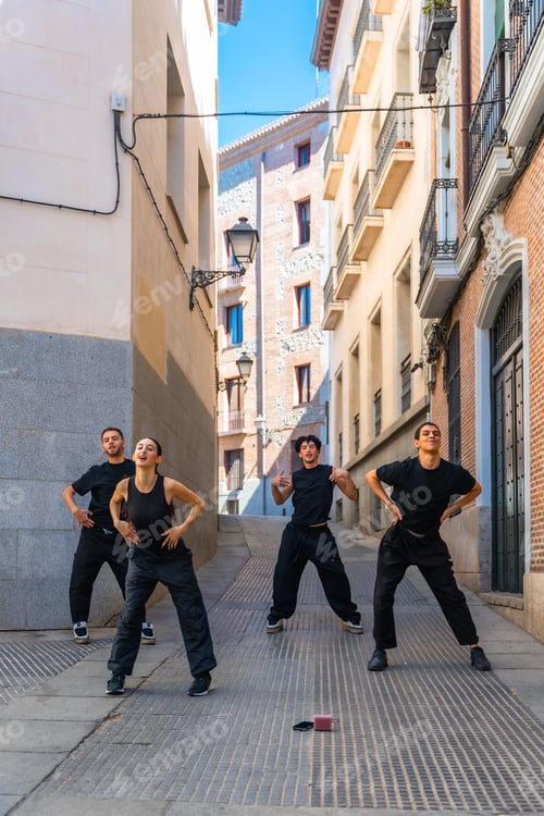 Preview: Young dancers performing street dance in urban alley