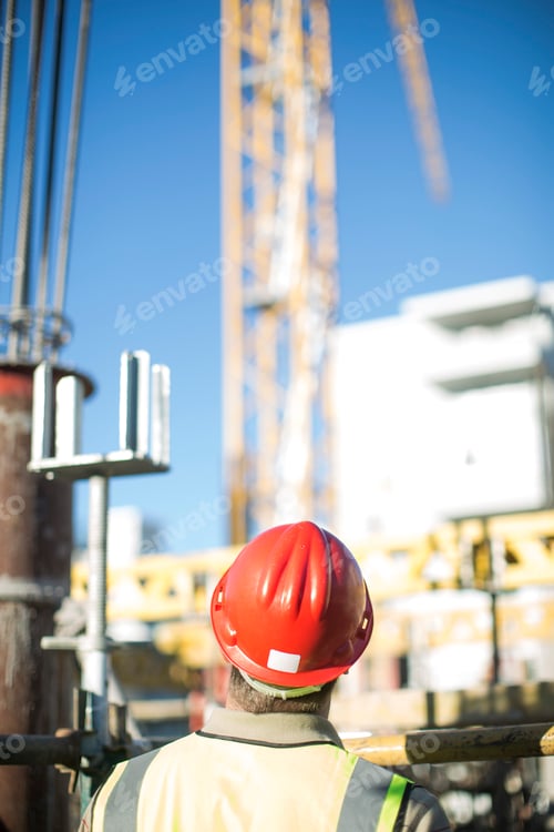 Preview: Construction worker wearing hard hat on construction site