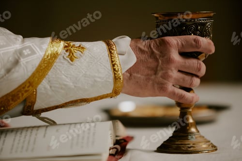 Preview: Hand Of Unrecognizable Priest Holding Cup Of Wine