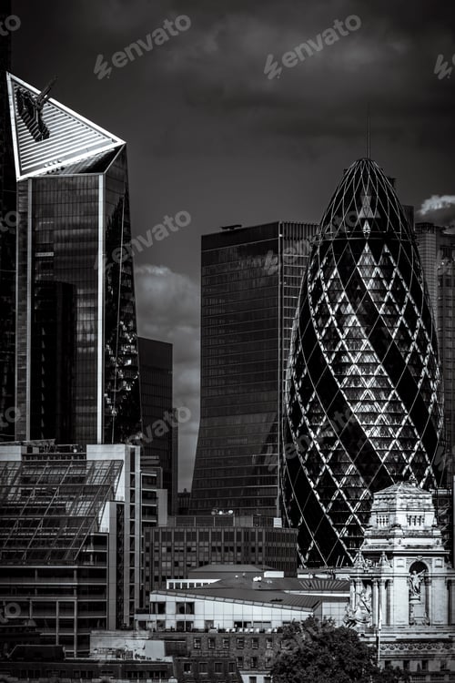 Preview: Vertical grayscale shot of a cityscape with high-rise buildings in London, England