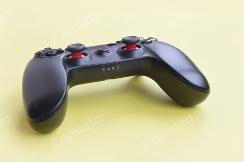 Preview: KHARKOV, UKRAINE - JANUARY 19, 2020: Gamesir g3s video game controller on yellow background