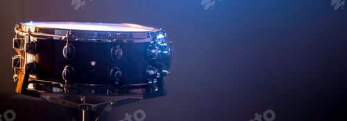 Preview: Snare drum on a dark background isolated with space for a text.