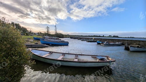 Preview: Old wooden fishing boats in Corrib lake at Annaghdown pier, county Galway, Ireland, nature backgroun