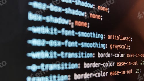 Preview: Screen of web developing code on dark background.