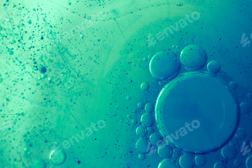 Preview: Close-up macro oil bubbles. Blue and green abstract backdrop