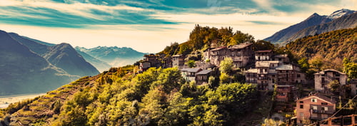 Preview: Town on top of hill and mountain range beyond
