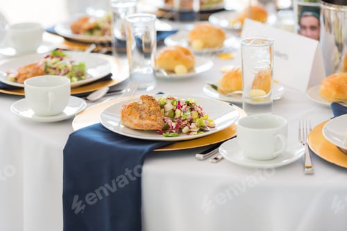 Preview: Large white table set, plated and served for guests