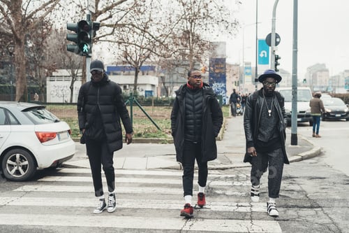 Preview: Three young african men crossing the street together