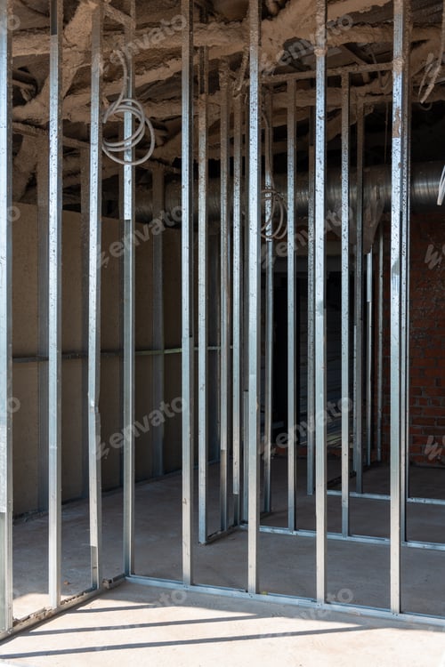 Preview: Construction of buildings. Metal rods for strengthening the walls of a building under construction.