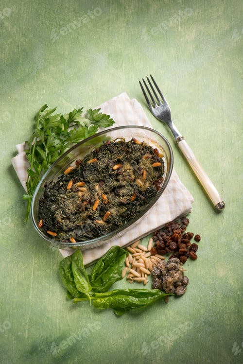 Preview: oven spinach with pine nuts dried grape and capers