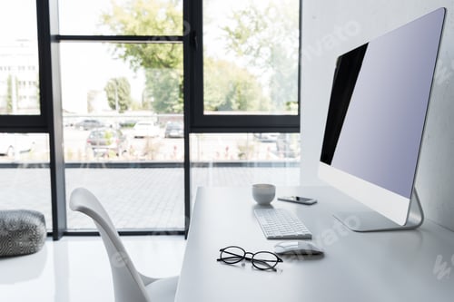 Preview: workplace with computer on white table in modern office