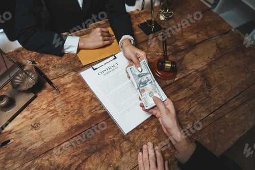 Preview: Client paying lawyer for contract agreement services