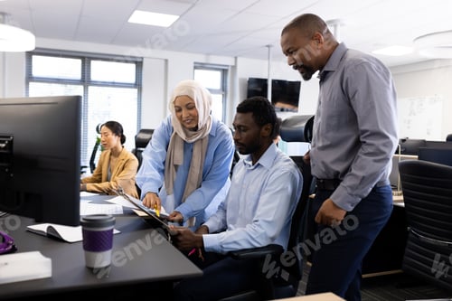 Preview: Diverse female and male businesspeople working in office