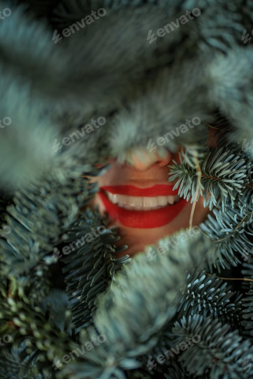 Preview: Women's face covered with nobilis branches