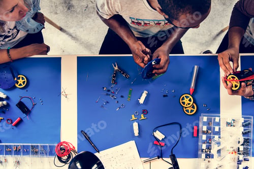 Preview: An aerial view of people working together in a mechanical workshop