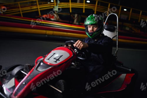 Preview: Man Driving Go Kart Wearing Green Helmet