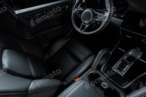 Preview: KYIV, UKRAINE - OCTOBER 7, 2019: leather car seat near steering wheel and gearbox in modern porshe