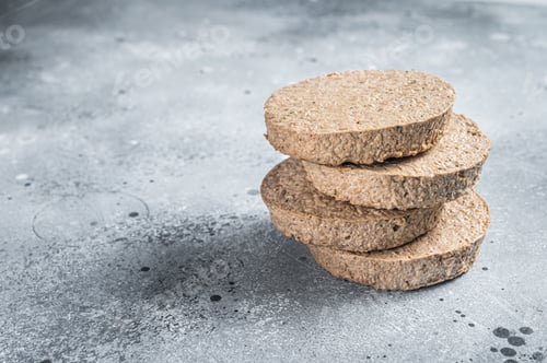 Preview: Raw Meat Free Plant Based Burger patties, vegetarian cutlets. Gray background. Top view. Copy space
