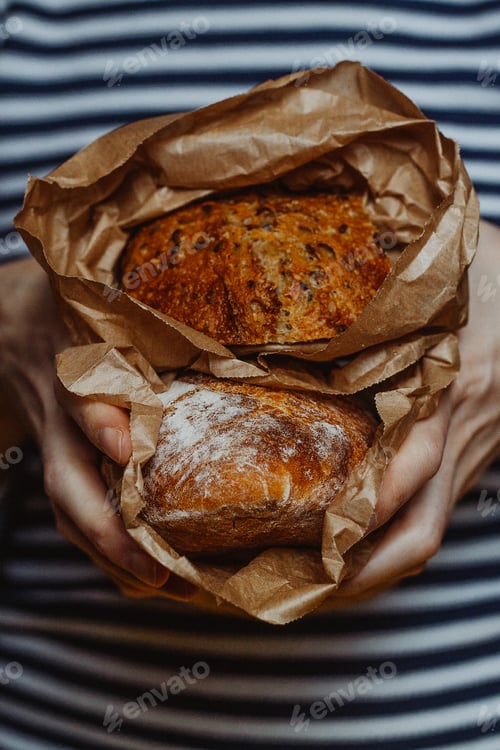 Preview: Fresh Artisan Breads Held in a Brown Bag