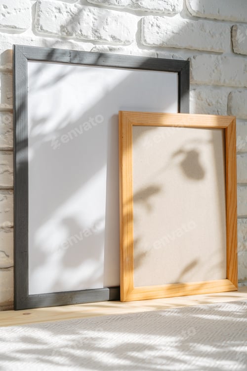Preview: Photo frames on floor over white brick wall