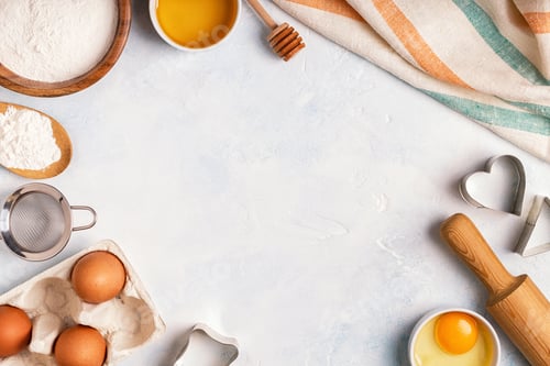 Preview: Ingredients for baking - flour, wooden spoon, eggs.