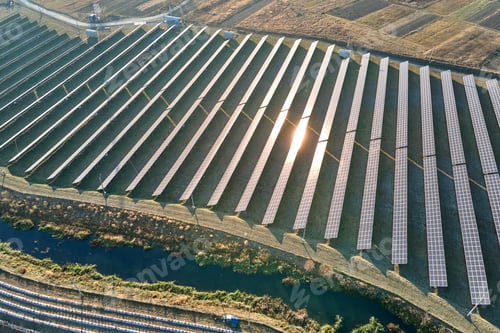 Preview: Aerial view of large sustainable electrical power plant with rows of solar photovoltaic panels