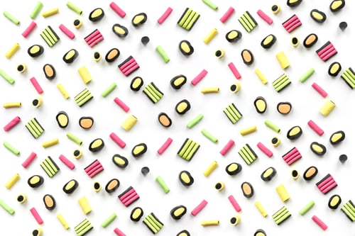 Preview: Colorful lollipop and licorice candy. View from above. Concept banner for design.