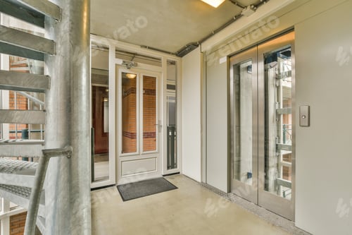 Preview: The facade of a brick building with wooden door