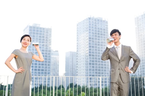 Preview: Business people with tin can phone
