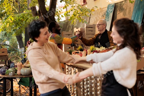 Preview: Happy loyal customer shaking hands with food market owner