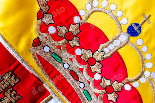 Preview: Close-up of the crown of the Spanish flag, macro of the royal design detail.