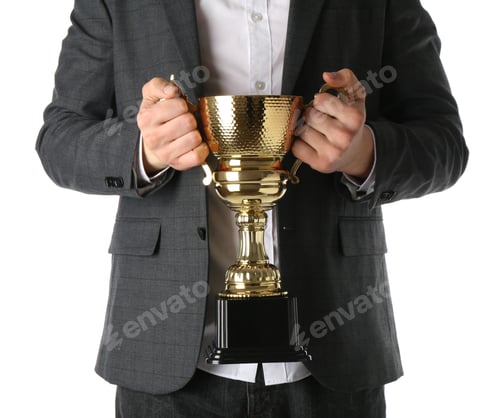 Preview: Man with golden trophy cup on white background, closeup